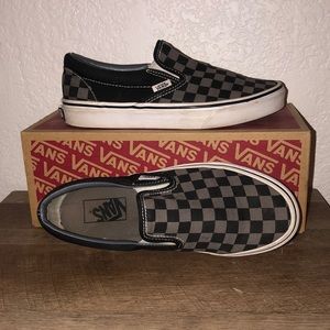 Rock out in style in these grey and black checkered slip on vans